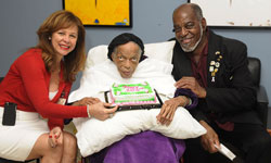 Image: Willie Mae Reed, center, celebrates her birthday with her doctor, Judella Haddad-Lacle, MD, and her son, Bernard Reed.