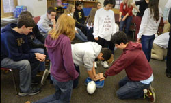 Image: Students at Episcopal School of Jacksonville practice hands-only CPR.