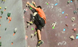 Image: Amputee Stephen France rock climbs at The Edge Rock Gym in Jacksonville.