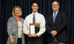 Image: Christopher Scuderi, DO (center), assistant professor of community health and family medicine, and medical director of UF Health Family Medicine and Pediatrics - New Berlin, receives the UF College of Medicine Excellence in Student Education Faculty Award from Edwards and Genuardi.