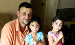 Image: Rahim Mohamad, shown here with two of his daughters, used to be unable to lift his children because of his pain.