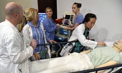 Image: Residents, from left, Ryan McKenna, DO (emergency medicine), Pamela Brownlee, DO (surgery), Song Pak, MD (anesthesiology), and Allie Bechtel, DO (pediatrics, not pictured) won this year’s Sim Wars Competition, which required participants to act out hypothetical emergency situations.