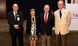 Image: James R. Scott, MD, second from right, was the keynote speaker during Celebration of Research. Scott, a professor of obstetrics and gynecology at the University of Utah School of Medicine, discussed alarming trends in medical research. Standing with him are, from left, Alan Berger, MD, associate dean of research affairs; Tina Bottini, assistant dean of research affairs; and Daniel R. Wilson, MD, PhD, dean of the UF College of Medicine – Jacksonville.