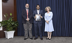 Image: Internal medicine resident Amit Kumar Babbar, MD, displays his plaque after winning the Excellence in Student Education Award during the UF College of Medicine – Jacksonville graduation ceremony June 10.