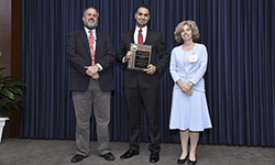 Image: Neurology resident Fahed Ahmed Saada, MD, neurology resident displays his plaque after winning the Louis S. Russo Award for Outstanding Professionalism in Medicine (Resident).