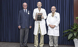 Image: Harry M. Northup, MD, professor and associate chair of radiology, displays his plaque after winning the Louis S. Russo Award for Outstanding Professionalism in Medicine (Faculty).