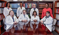 Image: The UF Health Jacksonville Comprehensive Multiple Sclerosis Program includes: bottom row, from left, Heather Barksdale, DPT, physical therapist; Scott Silliman, MD, director; Kalina Sanders, MD, associate director; Kelly O’Brien, ARNP; top row, from left, Adrienne DeBerry, PharmD; Catrina Graham, PharmD; Adam Chaifetz, DC, program coordinator; and Crystal Adams, MSW, neurology social services director. Christina Hampton, DPT, physical therapist, is not pictured. 