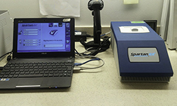 Image: A special scanner and computer accompany the Spartan Cube device.