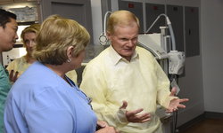 Image: Nurse Manager Ellen Gregory, RN, visits the NICU with Sen. Bill Nelson to show him where UF Health Jacksonville nurses provide lifesaving care to newborns.