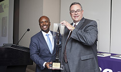 Image: Leon L. Haley Jr., MD, MHSA, left, stands beside John Haupert, CEO of Grady Health System, after receiving his award Oct. 4 in Atlanta.