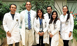 Image: UF COMJ pediatric resident Michael Haynes, DO (second from left), gathers for a photo with other residents and fellows who trained at Fundacion Cardioinfantil in Bogotá, Colombia. They are shown with attending physician Martha Alvarez, MD (pictured third from left), who helped establish the training partnership.