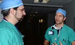 Image: Schwan, right, consults with Jason Widrich, MD, an assistant professor of anesthesiology at UF COMJ.