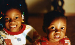 Image: Dr. LaRae Brown and Dr. Jeremy Coleman smile for the camera as children.
