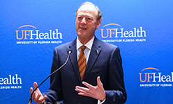 Image: David S. Guzick, MD, PhD, senior vice president for health affairs at the University of Florida and president of UF Health, addresses the gathering at the Friday, May 11, JAX-ASCENT ribbon-cutting ceremony.