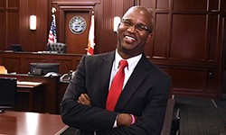 Image: Chris Jackson, an assistant state attorney for Florida’s 4th Judicial Circuit, turned to UF Health Jacksonville for a herniated disc treatment. He has been able to resume his judicial duties pain-free and with restored confidence.
