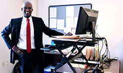 Image: Jackson prefers to use a standing desk, which allows him to stretch while working in his office. He says it’s good for his back.