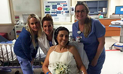 Image: Gina Francica surrounded by some of the UF Health nurses responsible for her care and her wedding planning.