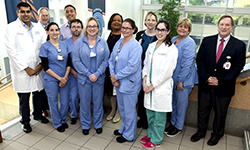 Image: Faculty and staff affiliated with UF Health Jacksonville’s Neonatal Intensive Care Unit gather for a photo. The group recently received a statewide award for a study detailing its quality improvement measures.