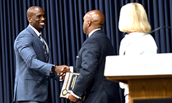 Image: Internal medicine resident Kevin Green, MD, receives the Ann Harwood-Nuss Resident Advocate Award from Leon L. Haley Jr., MD, MHSA, dean of the UF College of Medicine – Jacksonville.