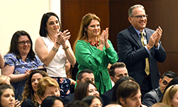 Image: Obstetrics and gynecology faculty members applaud during Celebration of Education.