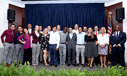 Image: Graduating emergency medicine residents gather for a group photo during the ceremony.