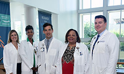 Image: Members of the UF Health Jacksonville Infection Prevention and Control team: Stefanie Buchanan, lead infection preventionist; Semaj Badger-McLendon, infection preventionist; Marko Predic, MS, infection preventionist; Marilyn Middlebrooks, MSN, manager, infection control; and Chad Neilsen, MPH, director of infection prevention and control.