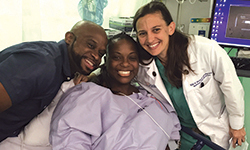 Image: Javier and La’Trece Bartley are all smiles alongside Erin Burnett, MD, who delivered Olivia.