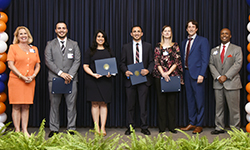 Image: Issa Hanna, MD; Maedeh Ganji, MD, MBA; Alexander Ghannam, MD; and Sandra Siller, MD, who gave platform presentations on their respective research projects, are flanked by college senior leaders while being recognized for their discoveries.