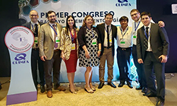 Image: In this photo from 2919, DeVos, pictured fourth from left, gathers with other attendees of the first Paraguayan Society of Emergency Medicine Conference in Asunción.