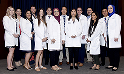 Image: Graduates of the pediatric residency program gather for a group photo during Celebration of Resident and Fellow Education and Research Day.