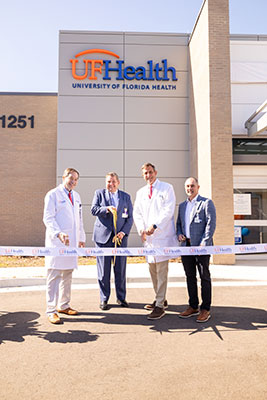 Image: Dr. Edward Roe III, Greg Miller, executive vice president and chief operating officer of UF Health-Jacksonville, Dr. Andy Godwin and Dr. Jay Woody, founder of Intuitive Health, cut the ribbon Jan. 27 at the UF Health Emergency & Urgent Care Center - Baymeadows.