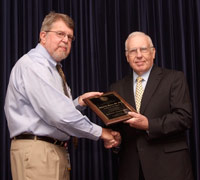 Image: Robert L. Wears, M.D. receives the 2010 Faculty Research/Scholar of the Year award from Robert C. Nuss, M.D. 