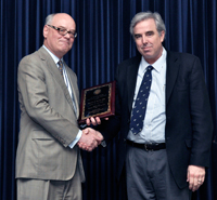 Image: Charles W. Heilig, M.D. (right) accepts the 2012 Robert C. Nuss Researcher/Scholar of the Year award from Daniel R. Wilson, M.D., Ph.D. (left)