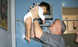 Image: Hudson Berrey, MD treating patients during a mission trip to Peru, in which he treated patients free of charge.