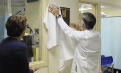Image: Dr. Joseph Tepas unveils the plaque while Patti Frykberg watches.