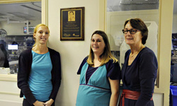Image: Eric Frykberg’s daughters, Eric Glas and Jessica Vogel, stand by the plaque with their mother, Patti Frykberg.